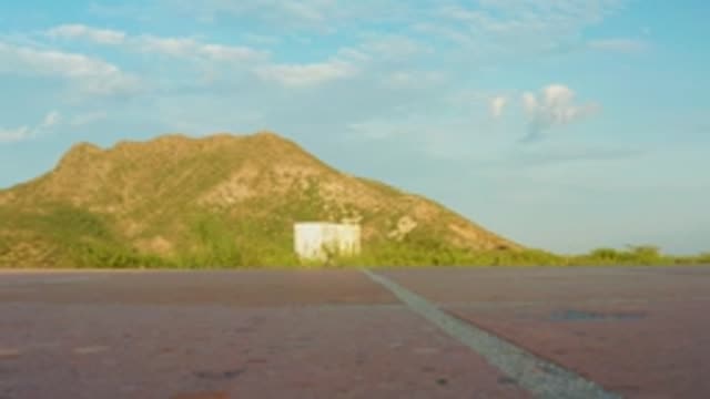 CABO PULMO LOS CABOS BCS MEXICO-2022: Road Leading to Mountain Under Blue Sky with Clouds
