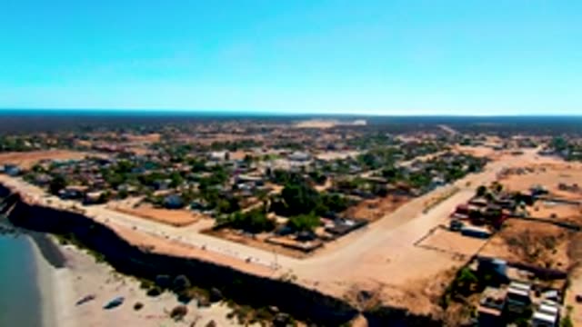 SAN JUANICO BCS MEXICO-2022: Sandy Beach with Boats Moving on Shore
