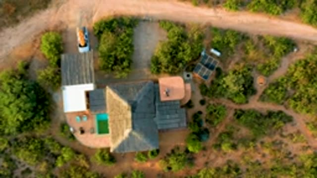 CABO PULMO LOS CABOS BCS MEXICO-2022: Car Moving Along Dirt Road Near House