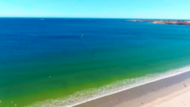 SAN JUANICO BCS MEXICO-2022: Swimmers in the Ocean near a Sandy Beach