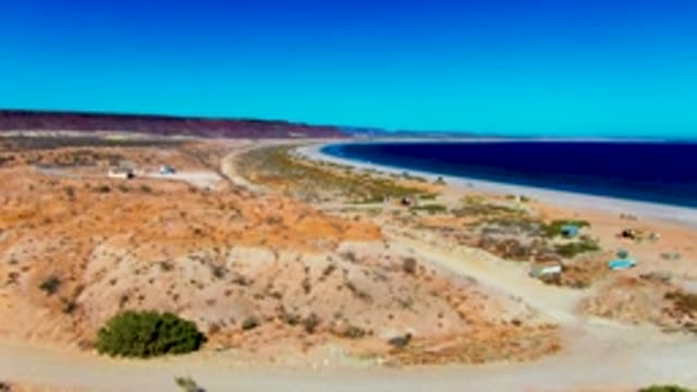 SAN JUANICO BCS MEXICO-2022: Vehicles Moving Along Coastal Desert Road