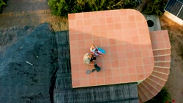 CABO PULMO LOS CABOS BCS MEXICO-2022: Two People on a Rooftop with Expanding Aerial View
