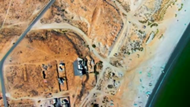 SAN JUANICO BCS MEXICO-2022: Beachfront Construction Site with Road and Water