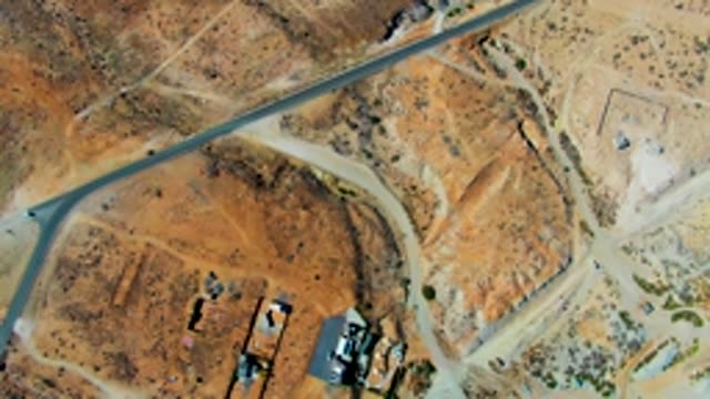 SAN JUANICO BCS MEXICO-2022: Aircraft Runway with Moving Vehicles in Arid Terrain