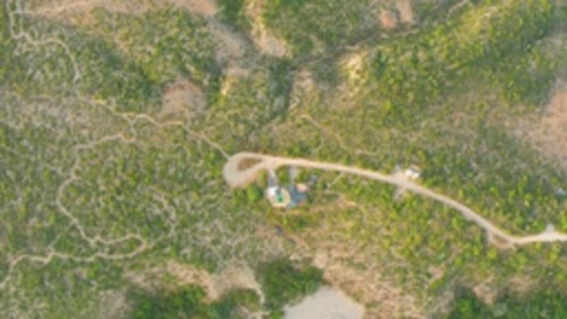 CABO PULMO LOS CABOS BCS MEXICO-2022: Vehicle Travels Along Dirt Road in Hilly Landscape