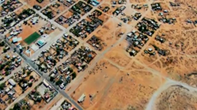 SAN JUANICO BCS MEXICO-2022: Residential Neighborhood with Moving Vehicles in Arid Landscape