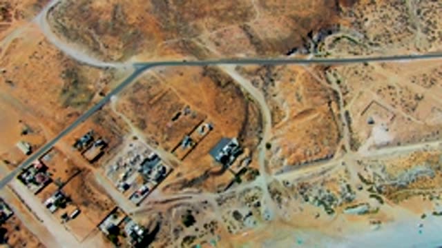 SAN JUANICO BCS MEXICO-2022: Fading White Line on Desert Road Aerial