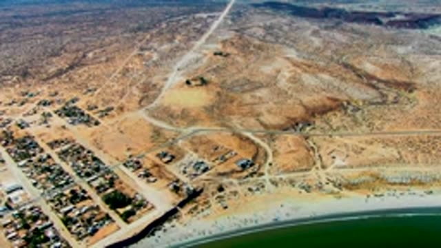 SAN JUANICO BCS MEXICO-2022: Coastal Desert with Residential Area and Beach Activity