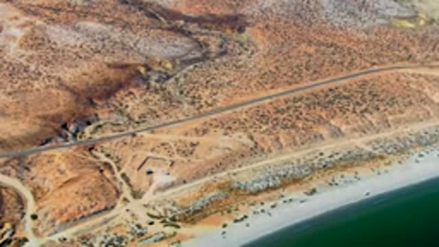 SAN JUANICO BCS MEXICO-2022: Coastal Desert Road with Moving Vehicle