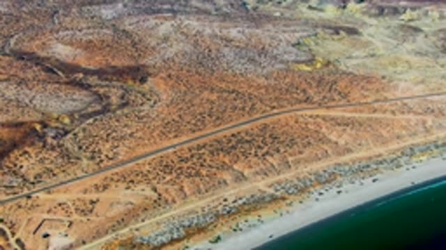 SAN JUANICO BCS MEXICO-2022: Coastal Road Winding Through Arid Desert