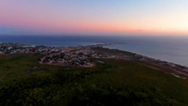 SAN CARLOS BCS MEXICO-2022: Coastal Town Dusk with Ocean and Winding Road