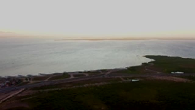 SAN CARLOS BCS MEXICO-2022: Coastal Boat Moving Past Shoreline