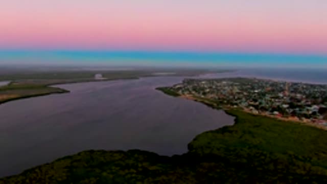 SAN CARLOS BCS MEXICO-2022: Coastal Town at Dusk with River and Forest