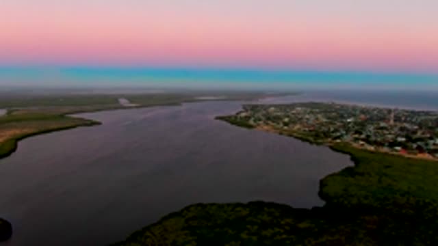SAN CARLOS BCS MEXICO-2022: Dusk Light on Coastal Water and Town