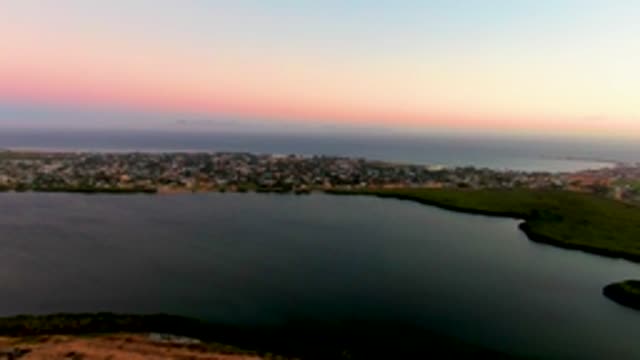 SAN CARLOS BCS MEXICO-2022: Coastal Town with Lagoon and Ocean at Sunset