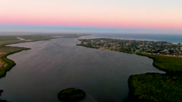SAN CARLOS BCS MEXICO-2022: Waterway with Town and Island at Dusk