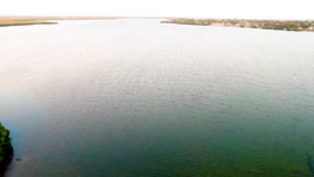SAN CARLOS BCS MEXICO-2022: Calm Water with a Boat Moving Away