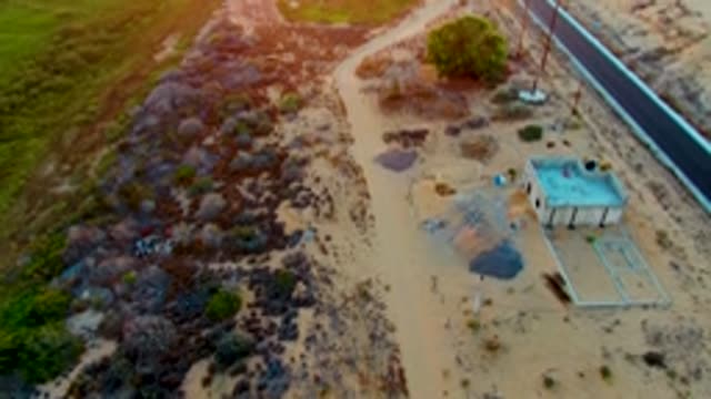 SAN CARLOS BCS MEXICO-2022: Desert Road and Small Building at Sunset