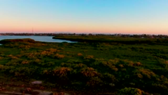 SAN CARLOS BCS MEXICO-2022: Aerial Dusk Over Water and Grassland