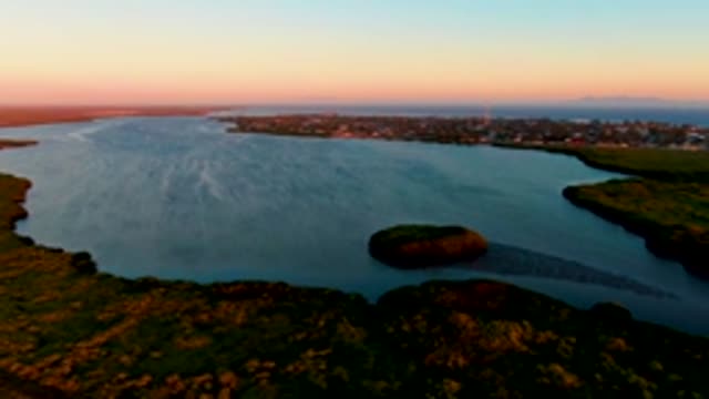 SAN CARLOS BCS MEXICO-2022: Aerial Bay with Island and Distant Town, Boat Disappearing