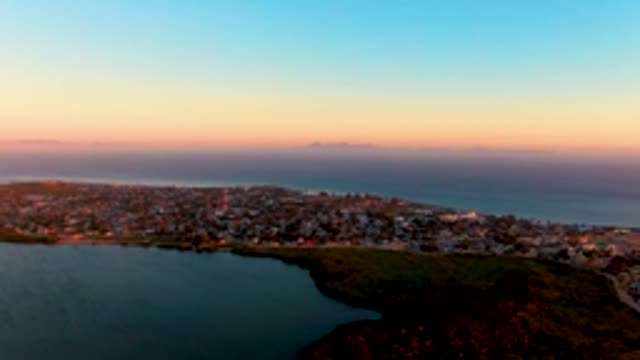 SAN CARLOS BCS MEXICO-2022: Coastal Town at Dusk with Lagoon and Ocean