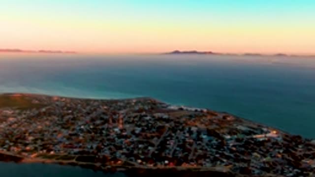 SAN CARLOS BCS MEXICO-2022: Coastal Town at Dusk with Ocean and Distant Islands