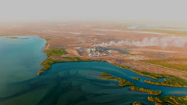 SAN CARLOS BCS MEXICO-2022: Industrial Plant Emitting Smoke Over Water