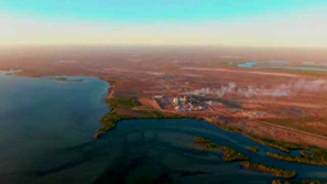 SAN CARLOS BCS MEXICO-2022: Industrial Site with Drifting Smoke Over Arid Waterways