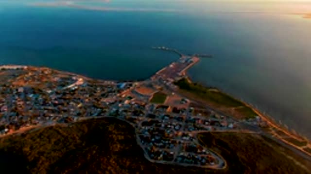 SAN CARLOS BCS MEXICO-2022: Coastal Town with Boat Moving Near Pier
