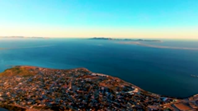 SAN CARLOS BCS MEXICO-2022: Aerial Pan of Coastal Town and Ocean