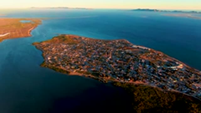 SAN CARLOS BCS MEXICO-2022: Coastal Town on Peninsula Under Changing Sunset Light