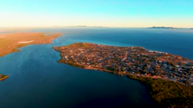 SAN CARLOS BCS MEXICO-2022: Coastal Town Nestled by Blue Waters and Green Land