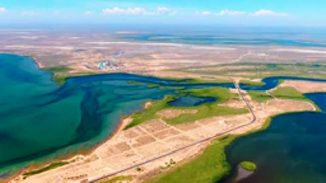 SAN CARLOS BCS MEXICO-2022: Vehicle Traveling Along a Coastal Causeway