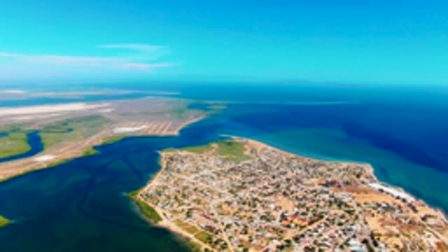 SAN CARLOS BCS MEXICO-2022: Shifting Sky Over Coastal Town and Water