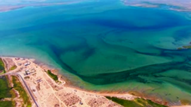 SAN CARLOS BCS MEXICO-2022: Coastal Water Currents Moving Along Sandy Shore