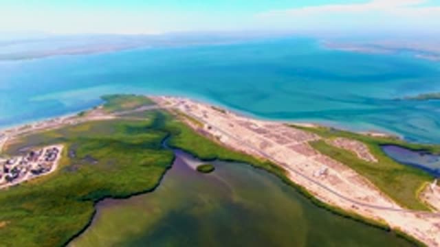 SAN CARLOS BCS MEXICO-2022: Vehicles Moving on a Coastal Causeway