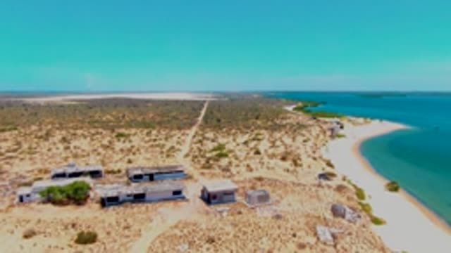 SAN CARLOS BCS MEXICO-2022: Coastal Structures on Arid Land Beside Sandy Beach