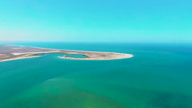 SAN CARLOS BCS MEXICO-2022: Vehicle Moving Along Narrow Coastal Island