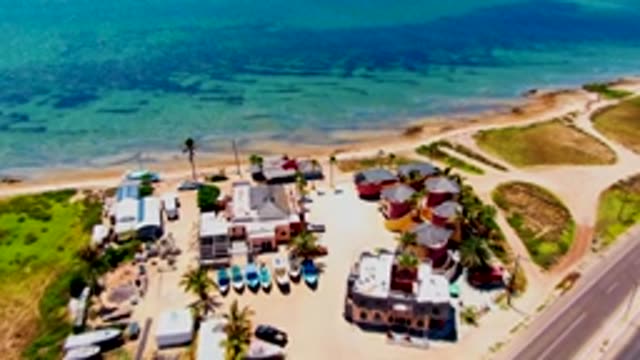 SAN CARLOS BCS MEXICO-2022: Beachside Village with Boats and Road