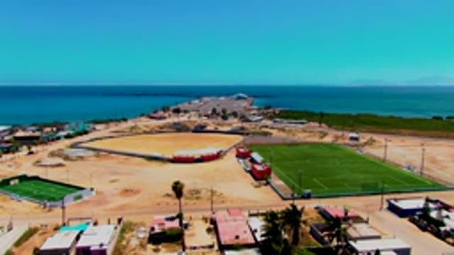 SAN CARLOS BCS MEXICO-2022: Coastal Baseball and Soccer Fields with Passing Vehicle