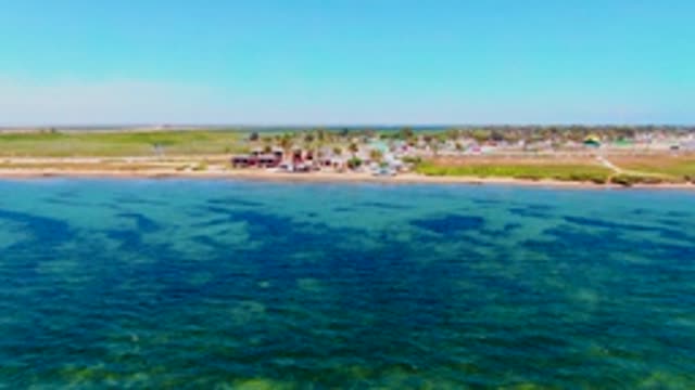 SAN CARLOS BCS MEXICO-2022: Coastal Beach with Clear Turquoise Water and Shore Structures