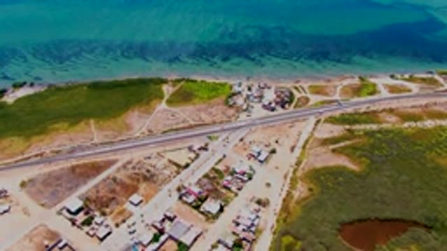 SAN CARLOS BCS MEXICO-2022: Coastal Highway with Residential Buildings and Ocean