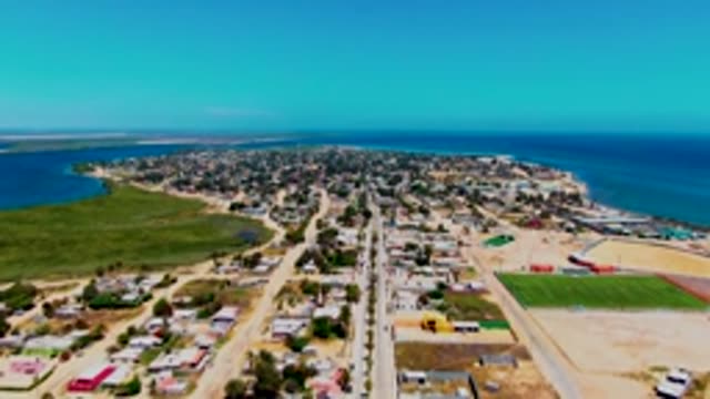 SAN CARLOS BCS MEXICO-2022: Coastal Town with Vehicles Moving on Main Road