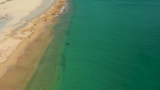 LOS FRAILES LOS CABOS BCS MEXICO-2022: Beach Shoreline with Gentle Waves and People