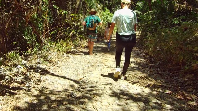 SAN PANCHO NAYARIT MEXICO-2022: Family Hiking on a Shaded Forest Path