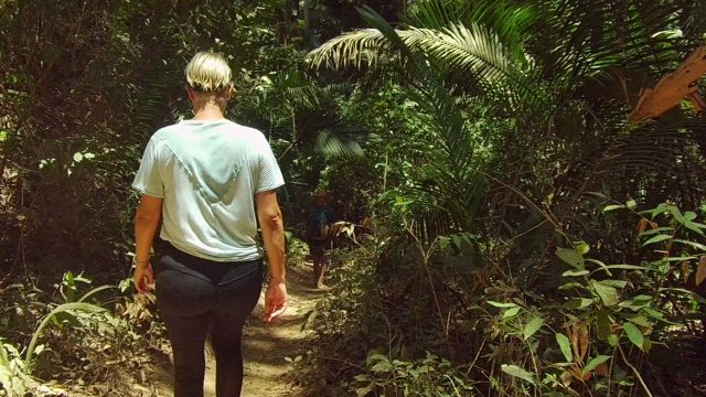 SAN PANCHO NAYARIT MEXICO-2022: Person Walking Along a Forest Trail with Another Person Ahead