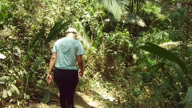 SAN PANCHO NAYARIT MEXICO-2022: Person Walking Through Dense Jungle Trail