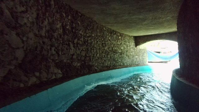 GUADALAJARA MEXICO-2022: Stone Archway with Flowing Water and Hammock