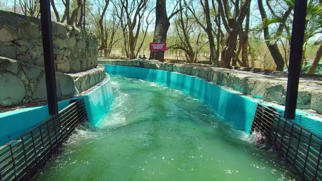 GUADALAJARA MEXICO-2022: People Sliding Down a Water Channel