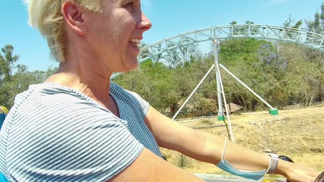 GUADALAJARA MEXICO-2022: Woman's Excited Reactions on Roller Coaster Ride
